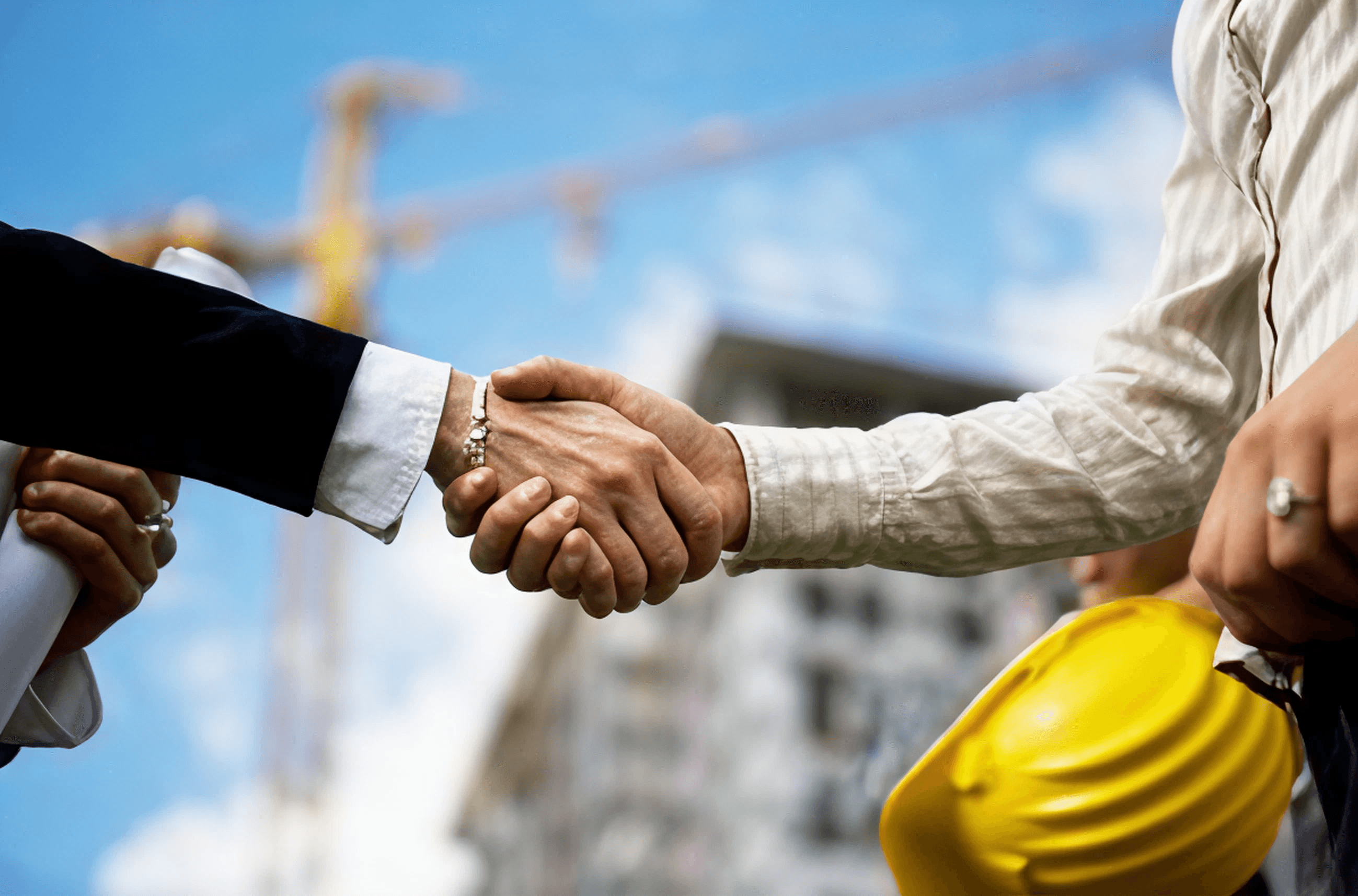 Construction professionals shaking hands
